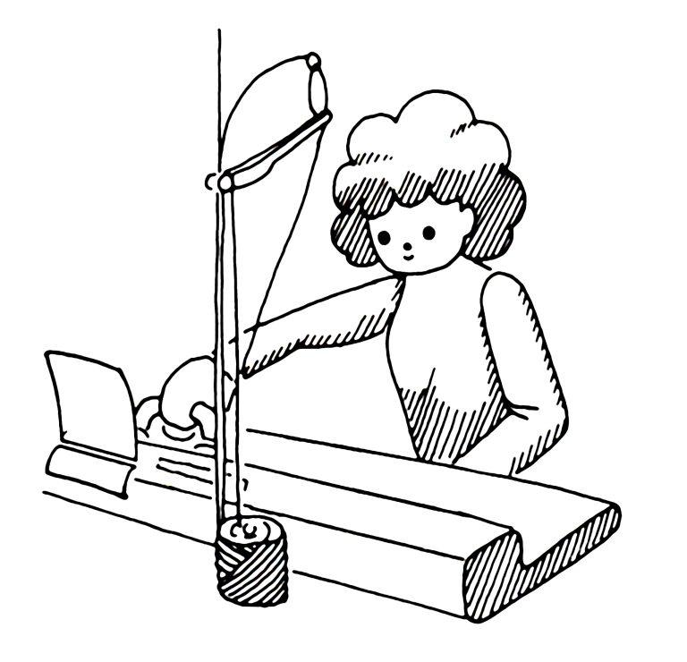 Persoon die breimachine gebruikt